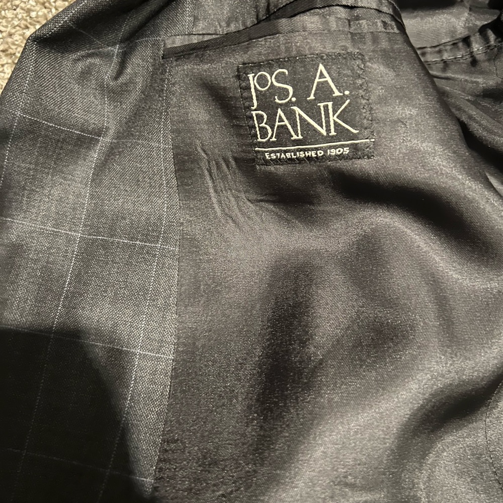 Jos a Bank 42r charcoal 2 button single vent with light blue stripes